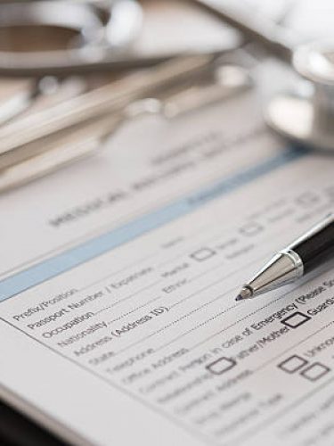 closeup pen on medical record application form. medical concept.